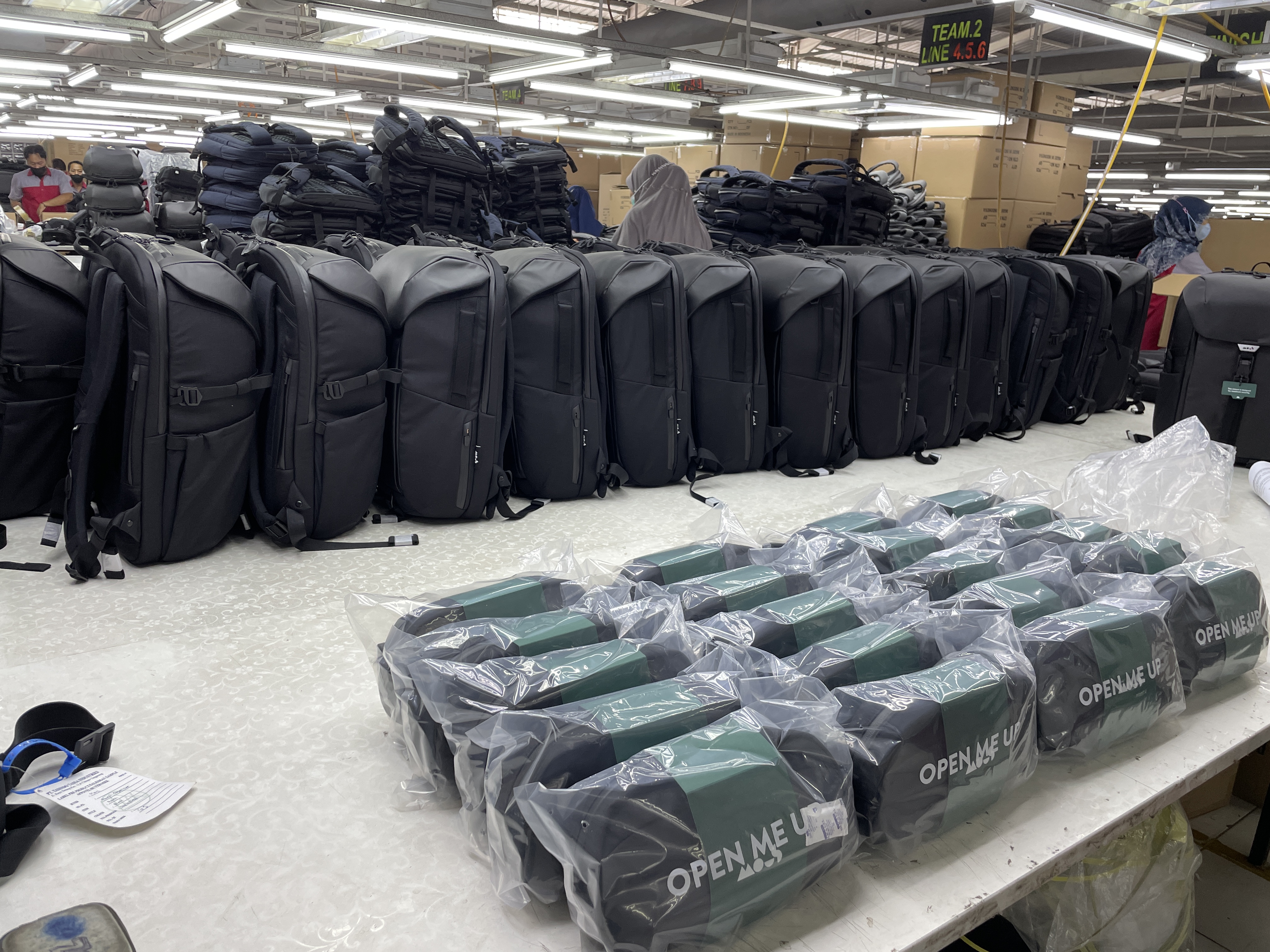 Production run complete, backpacks lined up for inspection