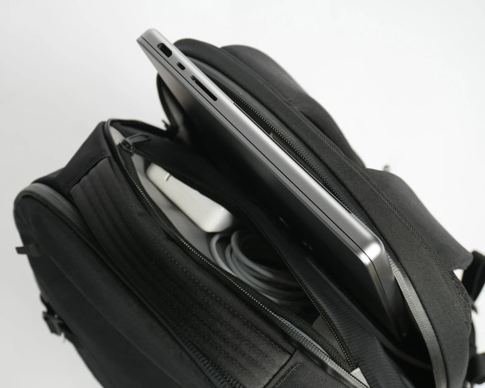 Dedicated laptop compartment detail with MacBook